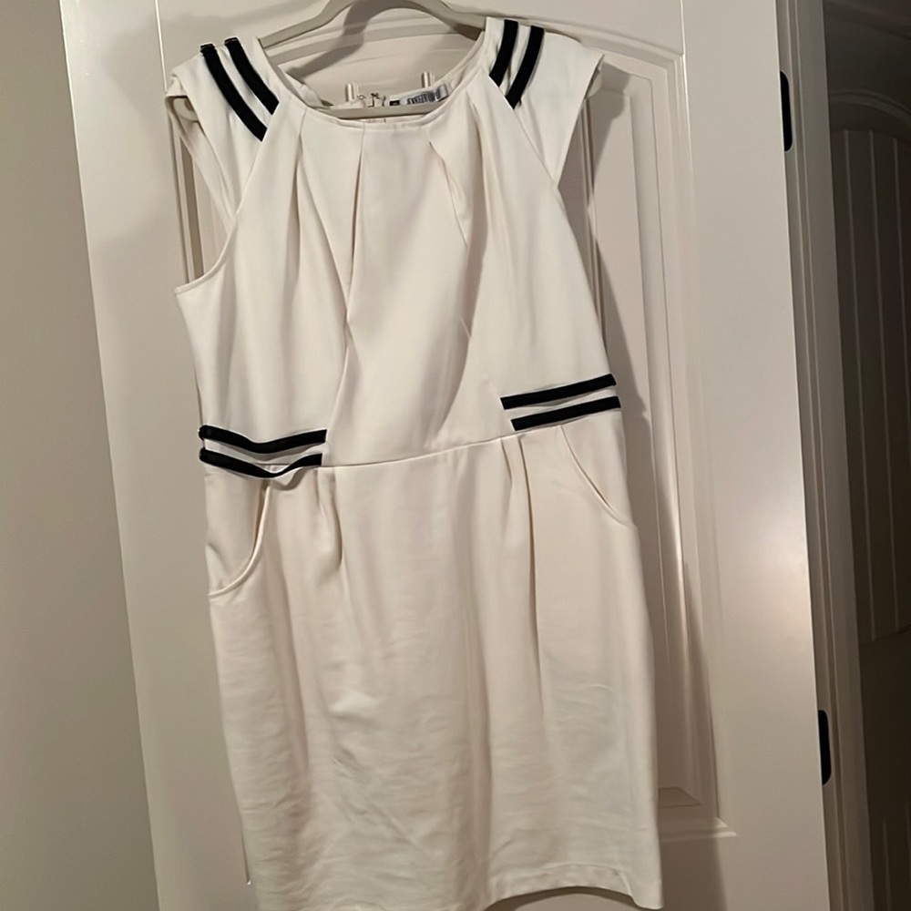 Cream ponte dress with back zip with leather look straps on shoulder and waist